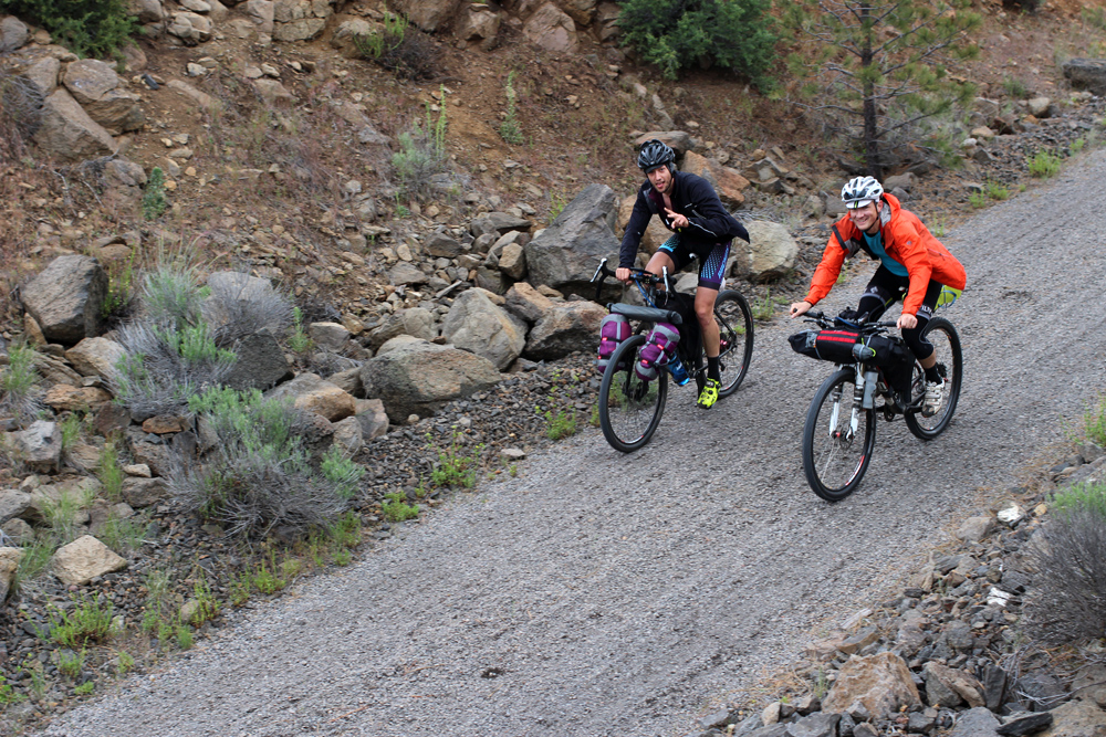  Ruckus test team rider Johnny and his amigo ride though an old railroad cut during a break in the rain. 
